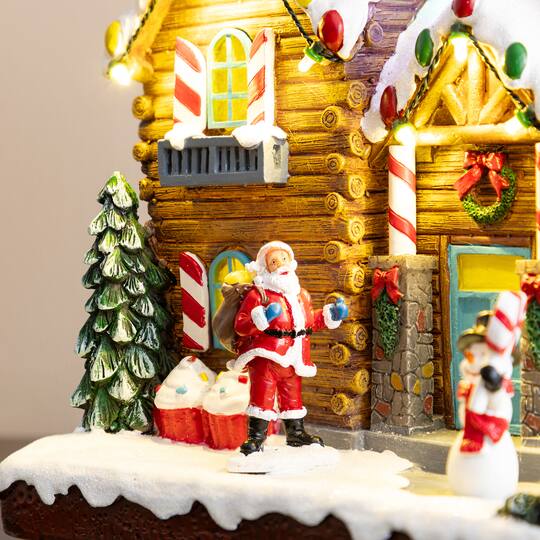 Glitzhome® 9" Lighted Christmas Candy Cane Inn Musical Resin Village with Timer